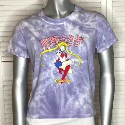 Juniors Sailor Moon cropped tee shirt. Features a rounded crew neckline, short sleeves, and cropped fit. Purple tie...