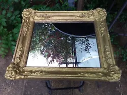 Un miroir ancien cadre bois et stuc quelques éclats de peinture dimensions 46 x 38 cm .