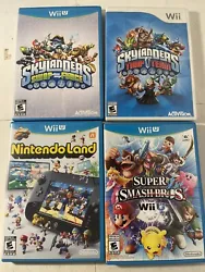 Lot Of 4 Wii— Wii U Games. Nintendoland, (2) Skylanders, Super Smash. Two of the games don’t have manuals. See pics