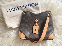 Beautiful 100% authentic designer Louis Vuitton Odeon PM Bag. - Brown monogram coated canvas with leather. Zip top...
