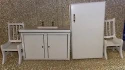 Sink, Refrigerator and x2 Chairs.