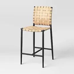 •Woven bar stool with a backed and armless silhouette •Metal frame offers style and support •Faux-leather woven...