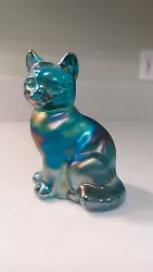 For sale, I have a marked Fenton cat figurine. There are no chips or cracks. It measures just over 3.5