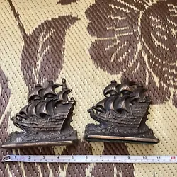 vintage pair of cast iron metal ship Sail boat bookends Nautical. From estate rust and tarnish and the top tips of the...