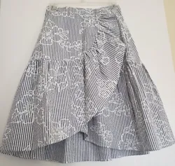 Seersucker fabric. Ruffle detail. Gray and white striped with floral detail. Knee length. Wrap silhouette. 70% Cotton...