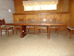 Dining room table with 10 matching chairs solid wood from the Philippines.Beautiful table hand made in 1959. Excellent...