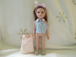 You get the Brunette with Brown Eyes doll wearing a blue shirt, sandals and headband. All in unplayed with condition....