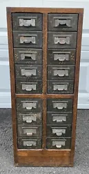 Offered here is an antique 18 drawer oak library filing card cabinet with raised panels and Japanned metal drawers,...