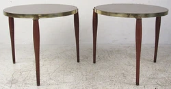 The sharp style of the brass trip wrapping around the top and tapered legs make it the perfect addition to any setting....