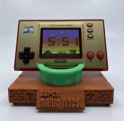 35th Anniversary Super Mario Brothers Game & Watch Stand (2020). Designed and 3D printed in-house. Rubber feet added to...