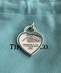 Hallmark: Tiffany & co ag925. Could be added it to your necklace or bracelet. RETIRED and not being sold at...