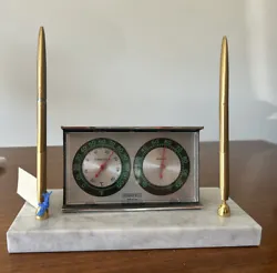This vintage mid-century desk clock set is a stunning addition to any home or office decor. Crafted from white marble...