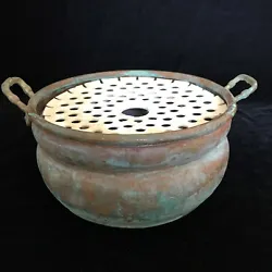 The copper pot was used as a base of a fountain. A small pump fits in the side of the copper pot base and you place...