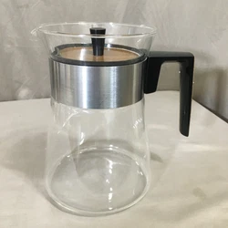 The carafe itself is glass, while the cover is plastic.