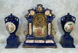 The clock and garnitures have a nice cobalt blue finish on the porcelain case and urns. The pieces date to probably the...