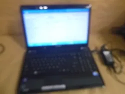 A good used laptop - missing hard drive/caddy/- boots to bios - includes laptop + ac adapter.
