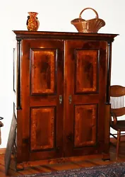 This auction is for an antique armoire, Biedermeier, made in Austria, cherry with ebony trim, stunning, good to...