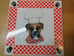 Item: Porcelain kitchen trivet featuring a boxer dog. Fabric: Porcelain and cork backing.