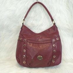 Beautiful Dana Buchman Shoulder Bag. Dana Buchman gold plate logo on front.