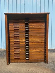 Antique oak Hamilton Mfg. letterpress type cabinet with 24 pull open cases for storing wood type fonts. There are 9...