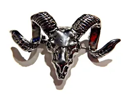 In shape of a goat or sheeps skull and horns.