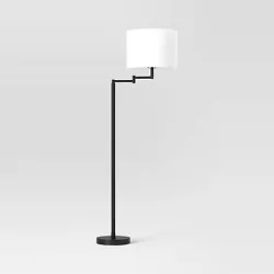 •Metal column floor lamp with drum shade •Features an adjustable swing arm •3-way touch-activated sensor switch...