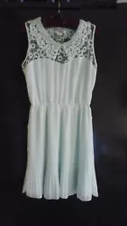 Its a beautiful, femine, classy dress in excellent, gently worn condition. Lacey collar on the top, elastic waist band,...