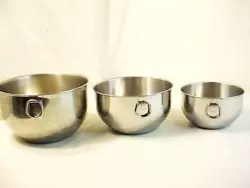 3 Farberware stainless steel mixing bowls with 2 thumb rings. The largest is made in the U.S.A and the 2 others are...