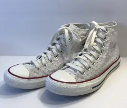 These white canvas Converse CTAS Hi sneakers feature a fun perforated star pattern, making them a stylish addition to...