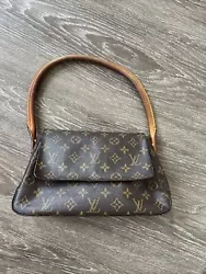 Authentic Louis Vuitton Monogram Mini Looping Shoulder Bag. Minor wear throughout the bag. See photos for details.