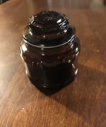 Vintage Small Amber Brown Glass Apothecary Spice Jar Canister With Starburst Lid. A small chip on rim of lid as seen in...