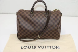 Speedy 35 Bandouliere Damier Ebene. Damier Ebene coated canvas. LOUIS VUITTON. Shoulder Bag. Inside flat pocket. Slight...