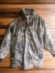Heavy, good condition. One side is brown camo and the other is light cream with brown branches.