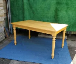 This wooden kitchen table is 3 ft by 5 ft long and wide. It has 2 screws per leg and is very sturdy.  Very clean and in...
