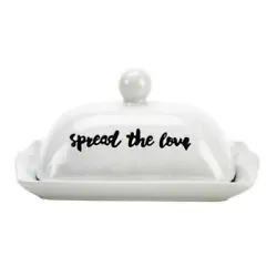 Glazed white butter dish features knob handle, scalloped edge and graphic print in black. Stoneware butter dish with...