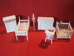 Lovely set of wooden painted white and pink baby nursery furniture. The set includes a crib, a clothes rack, a playpen,...