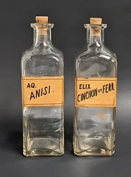 2 antique apothecary glass bottles. They do show residue on the inside. Approx 8.5