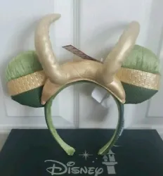 Magic in the details Created especially for Walt Disney World Resort and Disneyland Resort Golden faux leather Loki...