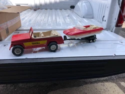 Trailer is in tact other than missing tow hook. Boat is good - crack in windshield. Jeep has play wear - overall good...