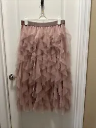 Indulge in a statement piece with this Anthropologie Ruffled Tulle Skirt in a beautiful rose color. The skirt falls in...