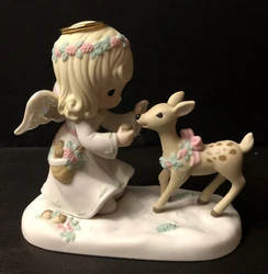 This beautiful Precious Moments figurine features an adorable angel and deer with the heartwarming message 