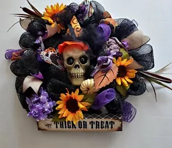 Halloween Festive Skeleton. The features on this wreath include the following Scary looking skeleton head in center...