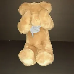 Mango tan teddy bear plush has magnetic paws that attract to his face so he can play peek-a-boo. The blue and white bow...