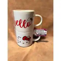 Cute set features (2) white mugs one with the face of Hello Kitty on one side, and Hello on the other. Both mugs are...