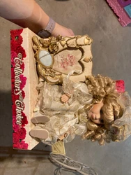 Antique Porcelain doll which has been on a shelf for years 