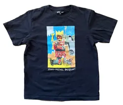 This Uniqlo T-shirt features an iconic Jean Michel Basquiat art print in black on a solid background. The crew neck and...