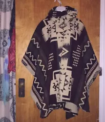 This is a BEAUTIFUL Alpaca poncho. It is unisex and one size poncho. It has 70% Alpaca and 30% Wool. It has an Aztec...