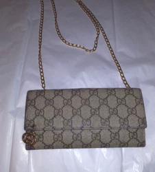 EUC With Light wear, leather interior, Convertible to a crossbody with a chain that can be placed under flap or inside...