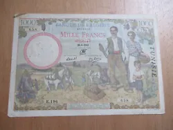 . il sagit là dun billet de 1000 francs de la banque dalgérie tamponné à usage de la Tunisie.