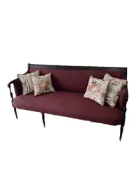 This is a beautiful antique upholstered sofa with burgundy diamond patterned upholstery. It rests on six legs and is...